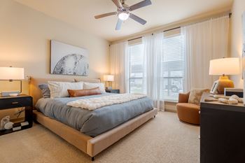 Bedroom with window and blinds